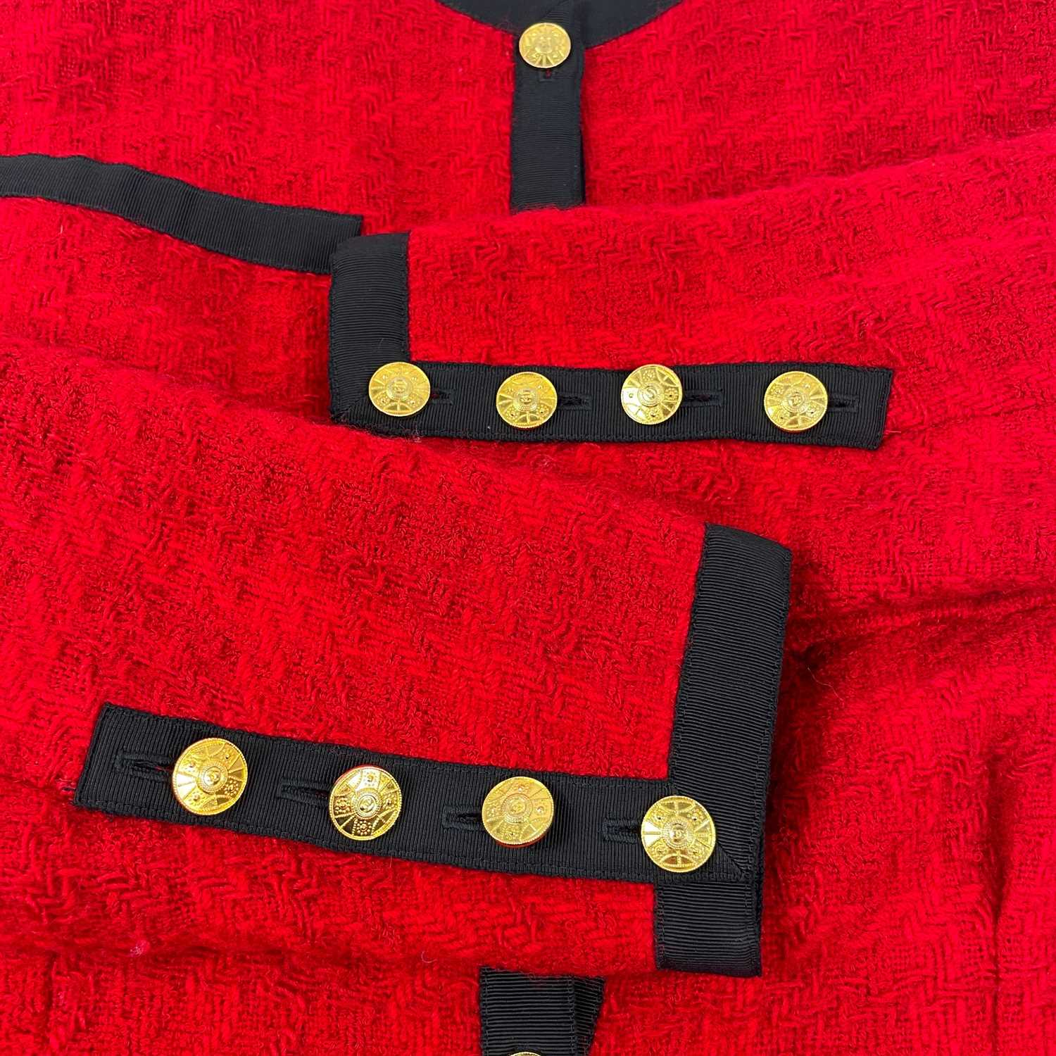 A Chanel 1980's red boucle jacket with gold plated buttons and black trim. - Image 8 of 9
