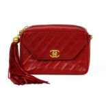 A Chanel red lambskin leather camera bag, circa 1991-1994.