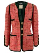A Chanel pink boucle tweed and green velvet trim jacket, circa 1990.