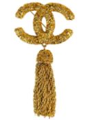 A Chanel 24ct gold-plated CC lava collection tassel brooch, circa 1993.