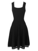 An Alaia Paris black mini dress.