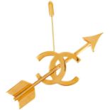 A Chanel 24ct gold-plated CC and arrow lapel pin, circa 1993.