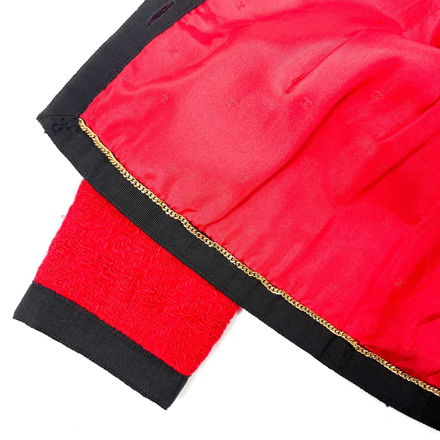 A Chanel 1980's red boucle jacket with gold plated buttons and black trim. - Image 9 of 9