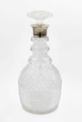 A George V silver mounted cut glass decanter and stopper by John Grinsell & Sons.