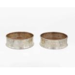 A pair of Contemporary silver wine coasters by M C Hersey & Son Ltd.