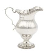 A heavy modern silver pedestal cream jug by Richard Comyns.