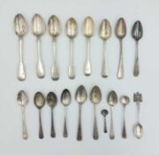 A collection of eighteen silver spoons.