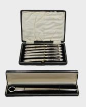 A cased silver paper knife by Warwickshire Reproduction Silver.