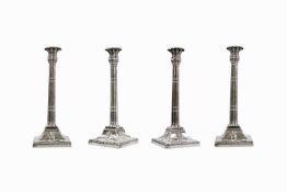 A good George III silver set of four matched candlesticks.