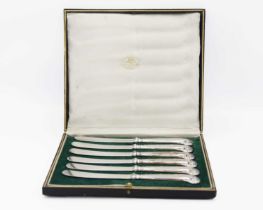A cased set of six George V silver pistol handled knives by John Sanderson.