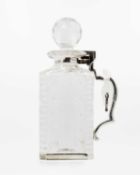 An Edwardian Betjemann's patent silver mounted cut glass locking decanter.