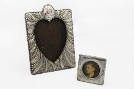 A George V silver embossed photograph frame by Synyer & Beddoes.