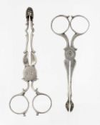 Two pairs of Georgian silver scissor action sugar nips.