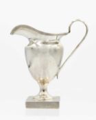 A George V silver pedestal cream jug.