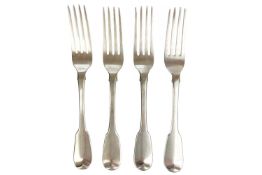 A George III silver set of four fiddle pattern table forks by William Eley & William Fearn.
