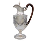 A Victorian silver pedestal claret jug by Charles Stuart Harris.