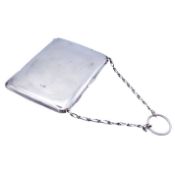 A George V silver purse with chain.