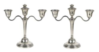 A pair of modern silver three-branch candelabra by Adie Brothers Ltd.