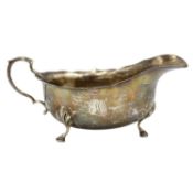 An Edward VII silver sauce boat by Walker and Hall.