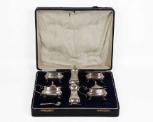 A George V silver six-piece cruet set by Adie Brothers Ltd.