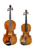 A viola and a violin, circa 1900.