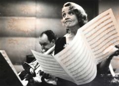 Signed; Eve Arnold (1912-2012) Marlene Dietrich, recording the songs she made famous during World Wa
