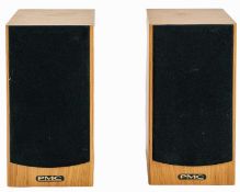 A pair of PMC DB1 bookshelf speakers.