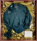 Original Billy Fury stage shirt in a display case.