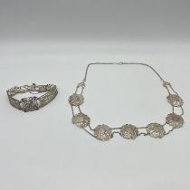 A silver filigree necklace and bracelet