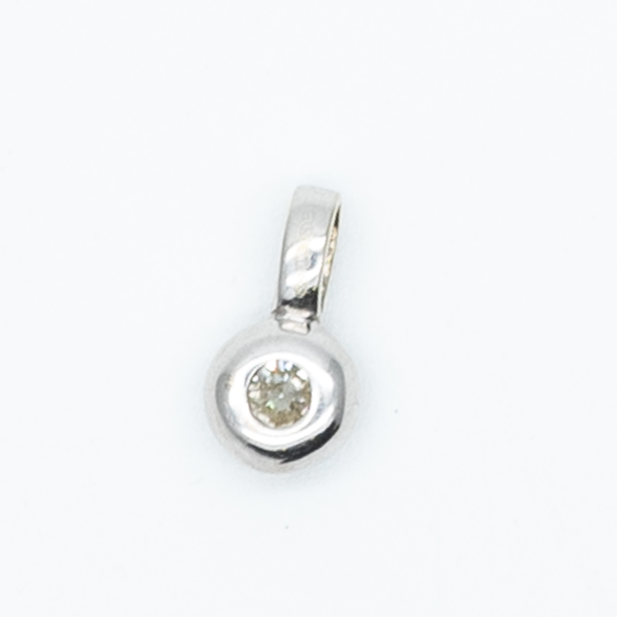 A 9ct white gold diamond pendant