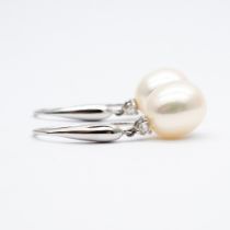 A pair of 18ct white gold pearl and diamond earrings