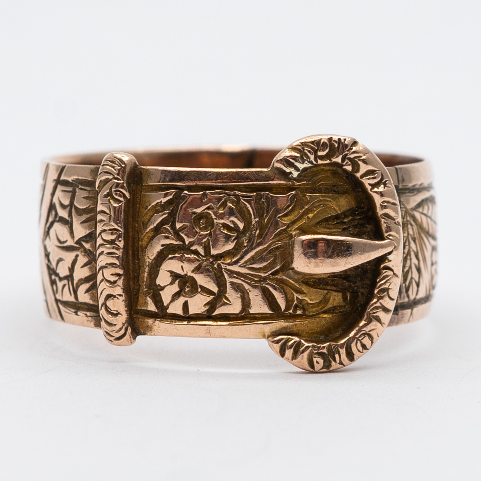 A 9ct rose gold fancy buckle ring