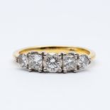 An 18ct yellow gold 5 stone diamond eternity ring