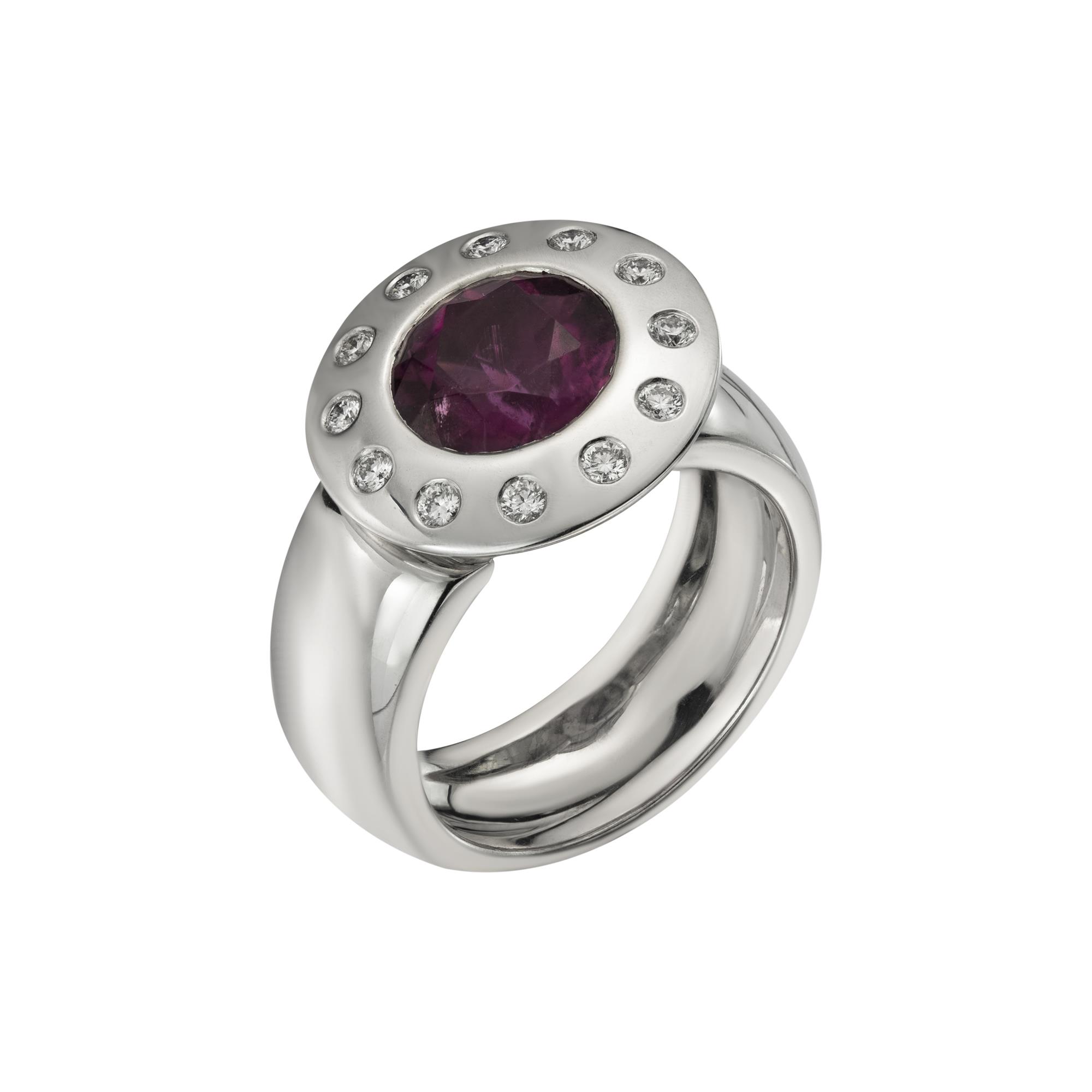 An 18ct white gold round rubelite and diamond dress ring