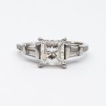 A platinum princess cut diamond solitaire ring