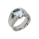 An 18ct white gold blue topaz and diamond dress ring