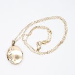 A 9ct yellow gold locket and chain