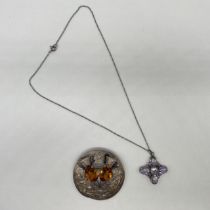 A silver Cairngorm brooch and a Victorian silver amethyst pendant
