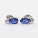 A pair of 9ct white gold tanzanite and diamond earrings