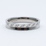 A platinum and diamond wedding band