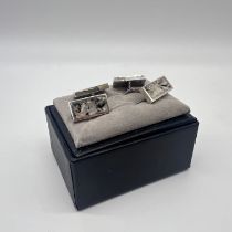 A pair of silver cufflinks