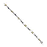 An 18ct white gold diamond with yellow and blue sapphire bracelet