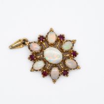 A 9ct yellow gold opal and ruby pendant
