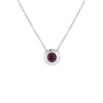 An 18ct white gold round rubelite and diamond pendant