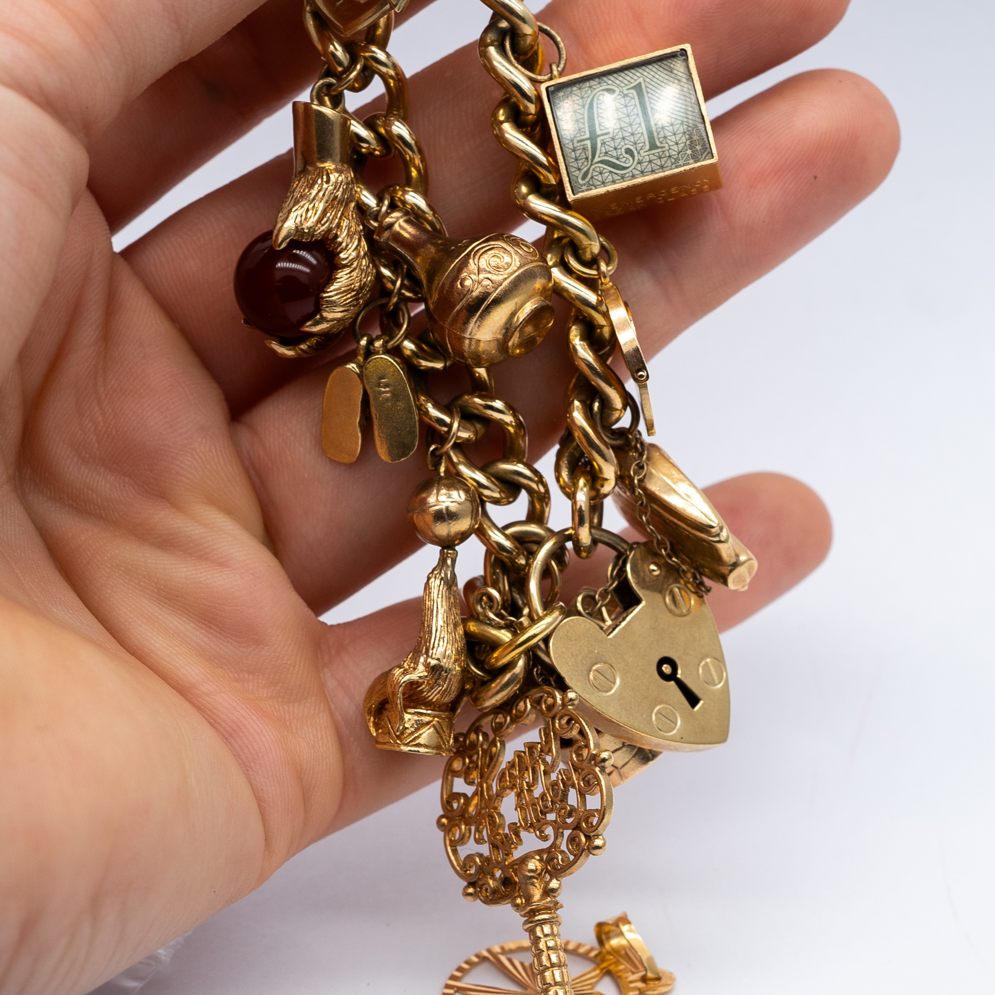 A 9ct yellow gold charm bracelet - Image 8 of 8