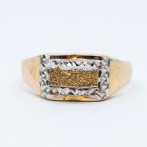 A 14ct yellow and white gold diamond cut design dress ring
