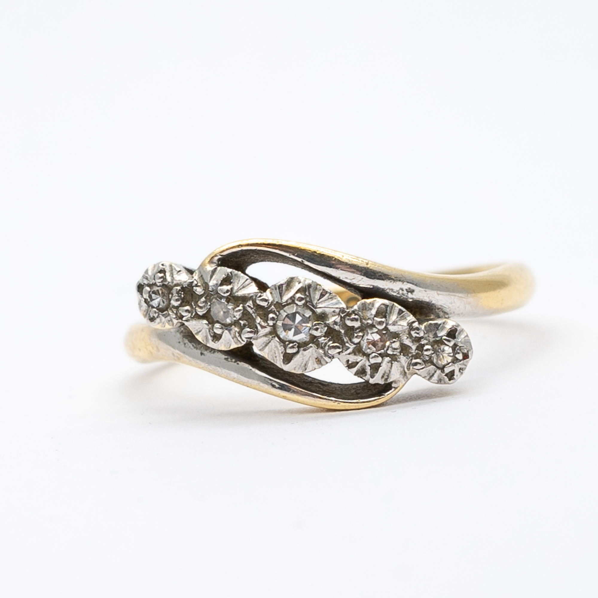 A vintage 18ct yellow gold and platinum 5 stone diamond twist ring