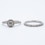 A platinum diamond engagement ring and wedding band