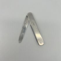 A silver measuring knife