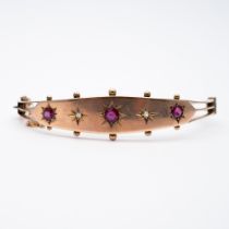 A 9ct yellow gold victorian ruby and diamond bangle